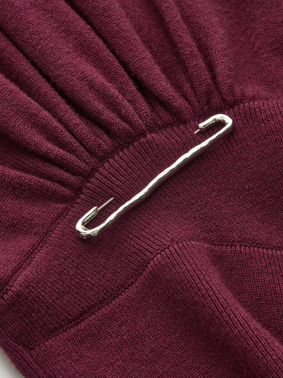 Asymmetric Turtleneck Knit Top with Safety Pin